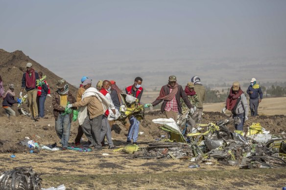 Rescuers work at the scene of an Ethiopian Airlines 737 MAX flight crash, in March 2019.
