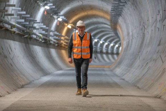 Premier Daniel Andrews walks through the partially constructed Metro Tunnel.