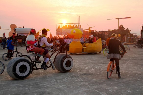 A sunset gathering on the playa during the 2014 Burning Man festival.