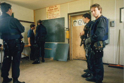 Keith Banks (right, looking at camera) with other undercover police at a training facility. 