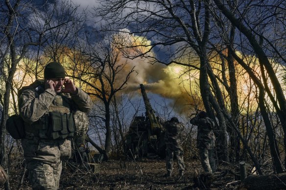 Ukrainian soldiers fire a self-propelled howitzer towards Russian positions near Bakhmut, Donetsk region, Ukraine.