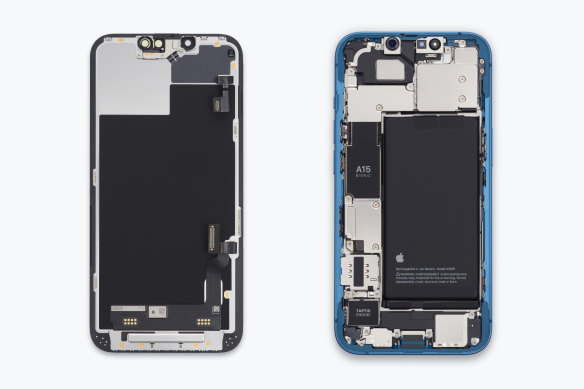The ‘bucket’ internal design of the iPhone 13. The piece on the left is the display assembly, which needs to be removed to get at any internal components.