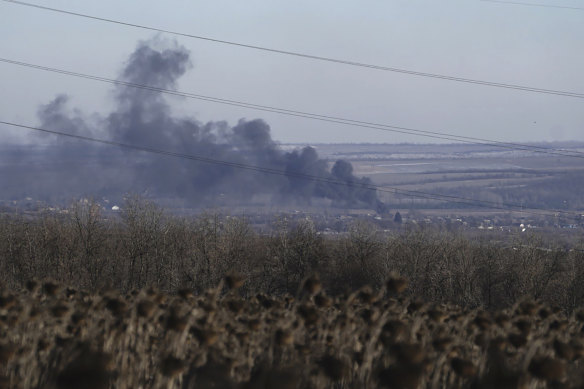 Smoke billows during fighting between Ukrainian and Russian forces in Soledar.