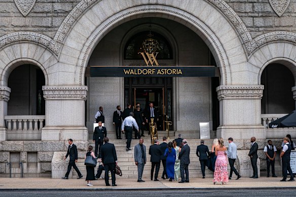 Guests arrive for the black-tie dinner, which was a do-over after the previous event was disrupted by a gunman.