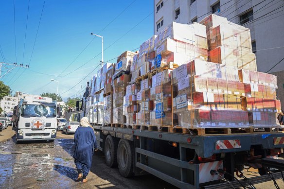 An International Committee of the Red Cross (ICRC) convoy of trucks carrying medical aid arrives at the Al Shifa medical hospital in Gaza City on November 7.  Aid agencies say that  without fuel they cannot coordinate further deliveries.