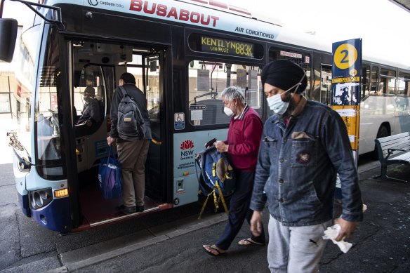 Bus passengers wear masks at Campbelltown on Friday.