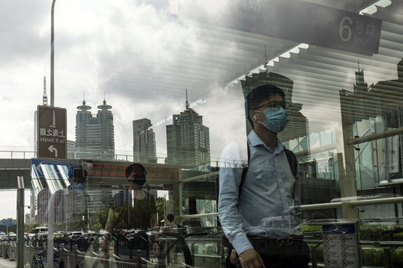 Pedestrians in Shanghai’s business district. A spike in cases last week fanned concern the city would be plunged back into lockdown. 