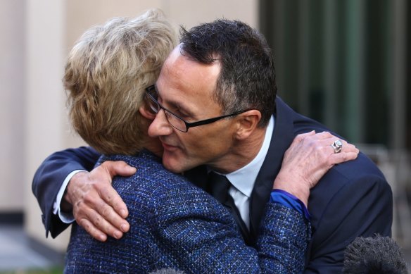 Former Greens leader Christine Milne embraces new Greens leader Richard Di Natale during a press conference in Parliament House in May 2015.