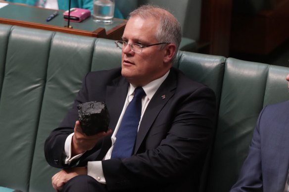 Then-treasurer Scott Morrison with a lump of coal in parliament in 2017. For the nearly 10 years the Coalition was last in office, global warming denialism was the clarion call of the party’s right faction.