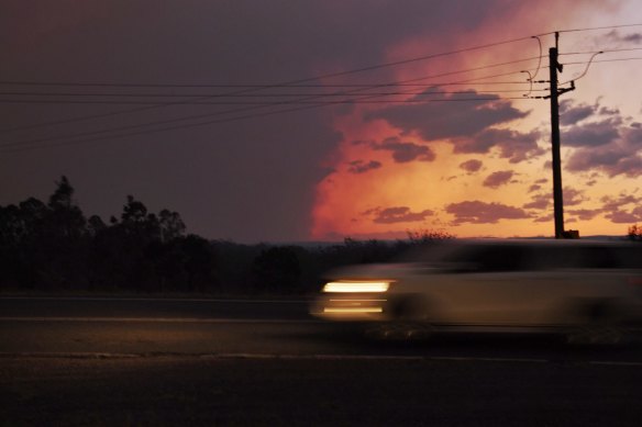 Silverdale RFS Brigade watch on as the Green Wattle Creek fire advances onLake Burragorang in early December.