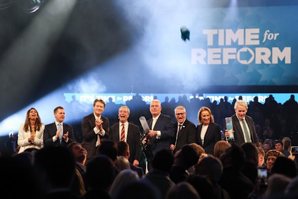 Rallying call: The Reform UK team Suella Braverman, Robert Jenrick, Richard Tice, leader Nigel Farage, Lee Anderson, Andrew Rosindell, Sarah Pochin and Danny Kruger following Farage’s speech in Birmingham in February.