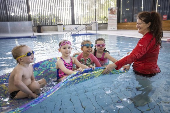 Swimming teacher Jennifer Wallace with students Body, 4, Zara, 4, Emmy, 4 and Joey, 5 at Noble Park Aquatic Centre. 