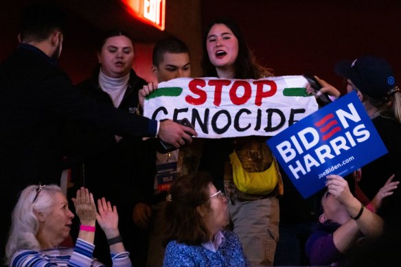 Protesters interrupt US President Joe Biden.