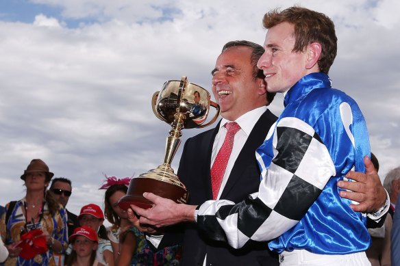 Andreas Wohler with Ryan Moore after Protectionist's Melbourne Cup win in 2014.