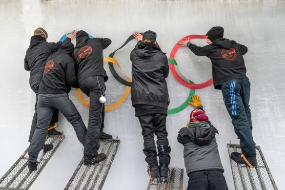 Ice makers install sub-glacial Olympic Rings at the sliding track at Yanqing Olympic Zone.