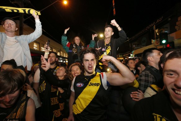 Richmond fans celebrate in Swan Street after the 2019 AFL grand final.
