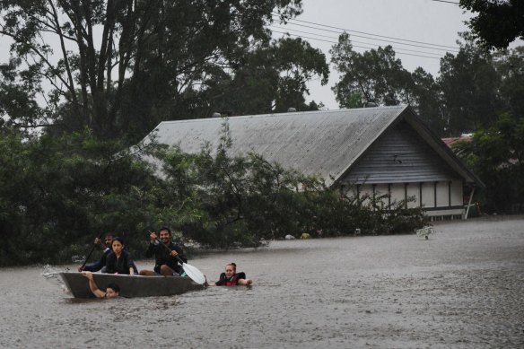 People and animals being rescued as severe flooding hit Lismore on Monday.