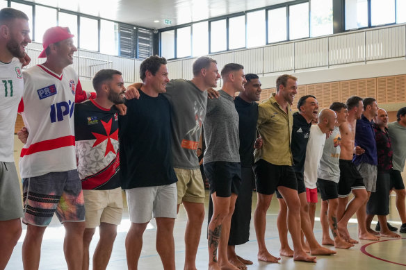 Arm in arm: Bulldogs players connect at St Gregorys.