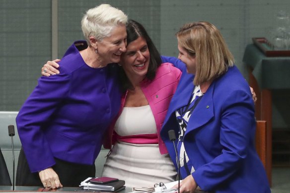 Kerryn Phelps, Julia Banks and Rebekha Sharkie celebrate after the medevac bill passes the House of Representatives.