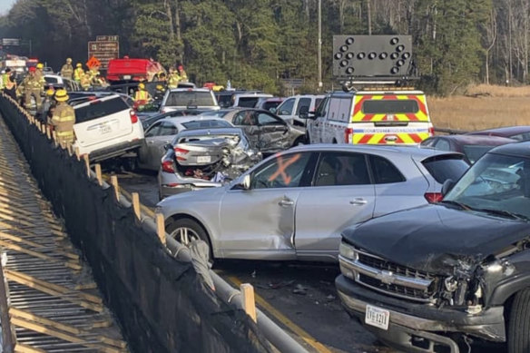 In this photo provided by the Virginia State Police, emergency personnel work at the scene of the multi-vehicle pileup.