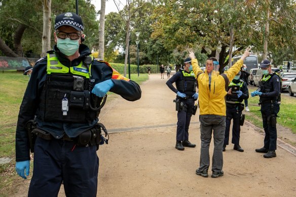 A man wearing a mask of Victorian Premier Daniel Andrews at an anti-lockdown protest in September.