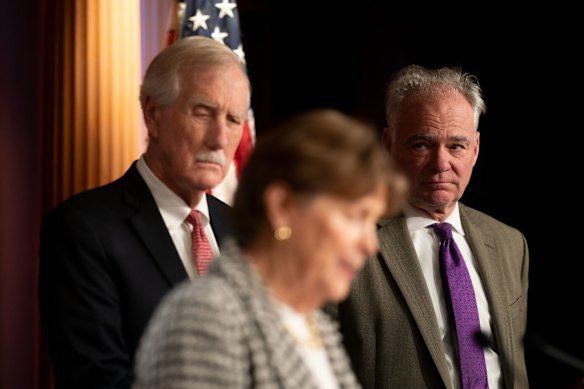 Democratic senators Jeanne Shaheen and Tim Kaine (right), and independent Angus King explain their decision to back the compromise plan at a late-night news conference in Washington.