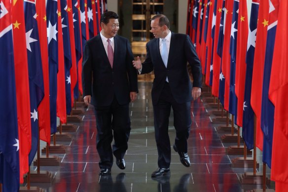 Former prime minister Tony Abbott with Chinese President Xi Jinping at Parliament House in Canberra in 2014.