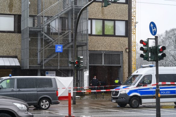 Police officers outside the Jehovah’s Witnesses church hall on Friday.