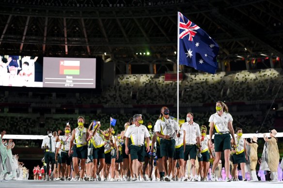 Flag bearers Cate Campbell and Patty Mills lead Team Australia out during the Opening Ceremony.