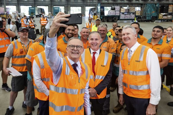 Opposition Leader Anthony Albanese mingling with workers in Queensland before he was sent into isolation. 