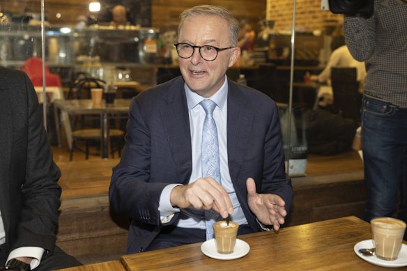 Opposition Leader Anthony Albanese meets with Labor candidate for Bennelong Jerome Laxale for a coffee in a cafe at Top Ryde City shopping centre in 2022. 