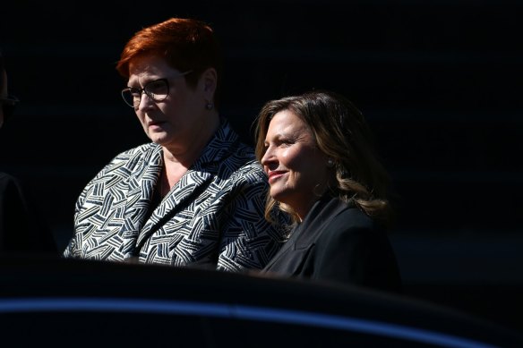Marise Payne and Jenny Morrison arrive at the state funeral for Carla Zampatti at St Mary’s Cathedral. 