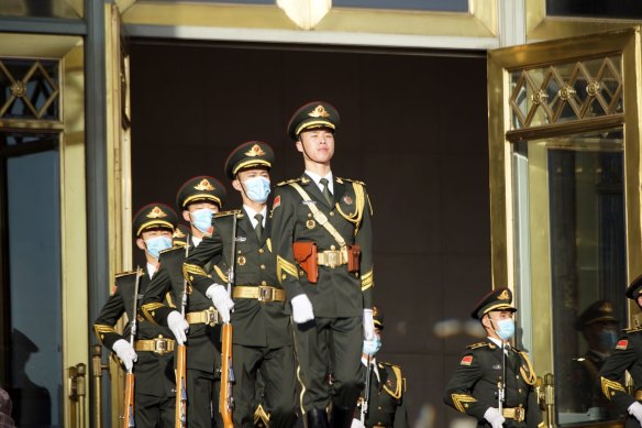 Members of the People’s Liberation Army (PLA) march outside the Great Hall of the People in Beijing on Wednesday. China also has devoted billions to its military.