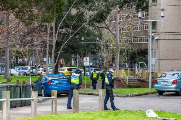 Police on patrol outside public housing towers in North Melbourne.