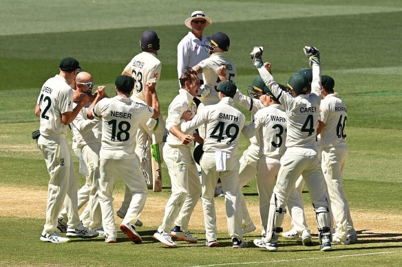 All in this together: Australia celebrate Nathan Lyon’s dismissal of Ben Stokes.