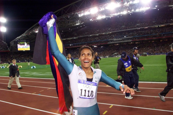 Cathy Freeman celebrates after winning gold at the Sydney Olympics.