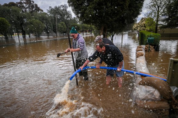 Their attempt to pump water out of the house did little to slow the inevitable.