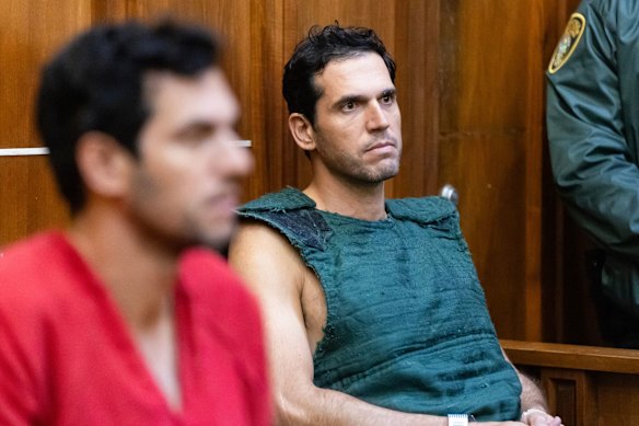 Oren Alexander, co-founder of Official Partners, left, and Alon Alexander brother of Tal and Oren Alexander, during a bond hearing in Miami. 