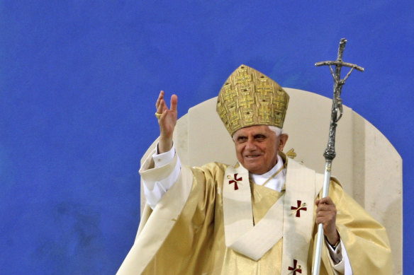 Pope Benedict XVI waves to pilgrims at the end of a papal Mass at the Islinger field in Regensburg, southern Germany, on September 12, 2006.