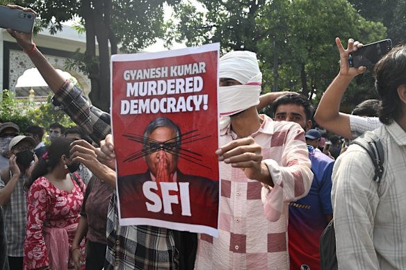 Protestors shout slogans against Chief Election Commissioner Gyanesh Kumar.
