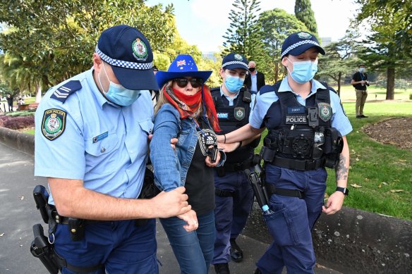 NSW Police arrest an anti-lockdown protester at Victoria Park on Saturday.