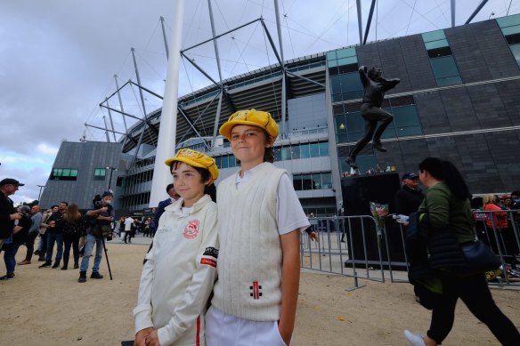 Sam Menner, 13, and Beau Menner, 11, outside the MCG before the Shane Warne memorial.