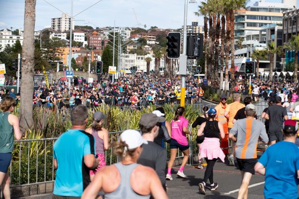 Runners arrive in Bondi for the conclusion of the City2Surf race.