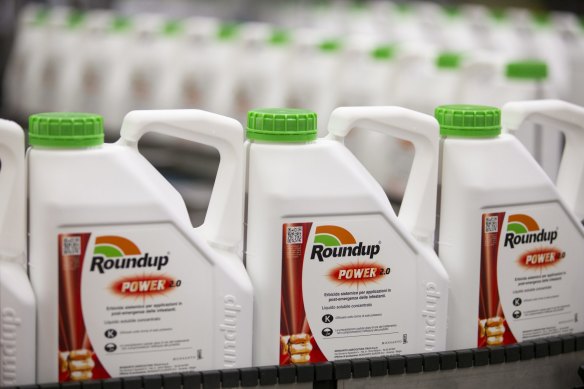 Bottles of Roundup weed killer move along the production line at the herbicide manufacturing facility.