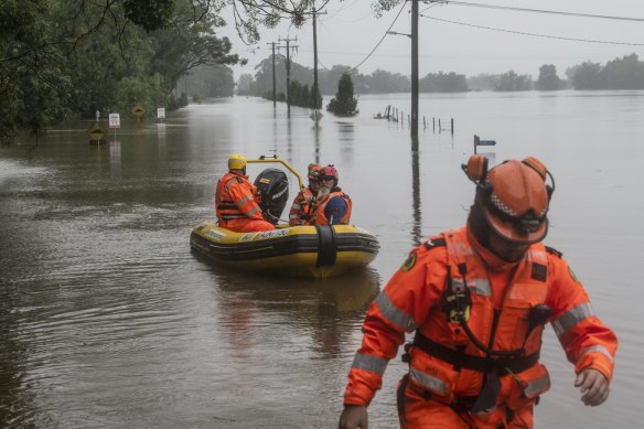 SES volunteers heading out to Ebenezer, near Windsor, on a flooded Hawkesbury River.