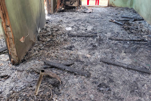 Debris and soot cover the floor of a middle school in Let Yet Kone village.