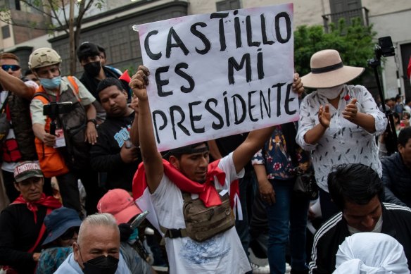 ‘My president’: Supporters of former president Pedro Castillo protest his arrest in Lima on December 9.