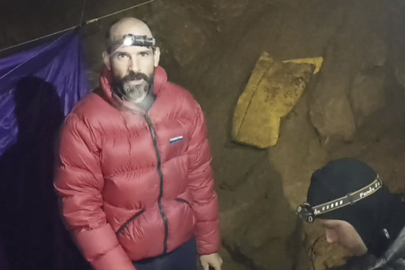 American caver Mark Dickey, 40, talks to camera next to a colleague inside the Morca cave near Anamur, southern Turkey.