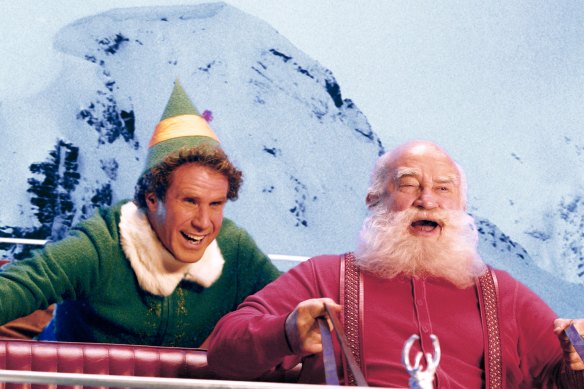 Asner as Santa Claus, right, with Will Ferrell in Elf.