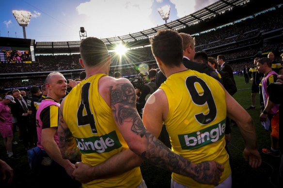 Martin with captain and friend Trent Cotchin after the 2017 grand final.